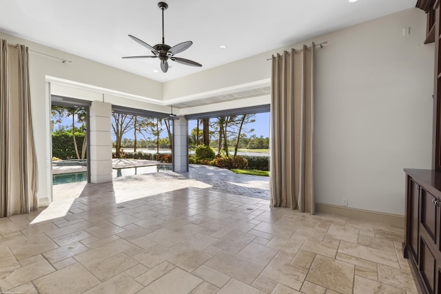 interior space featuring ceiling fan