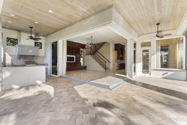 view of patio / terrace featuring an outdoor kitchen and ceiling fan