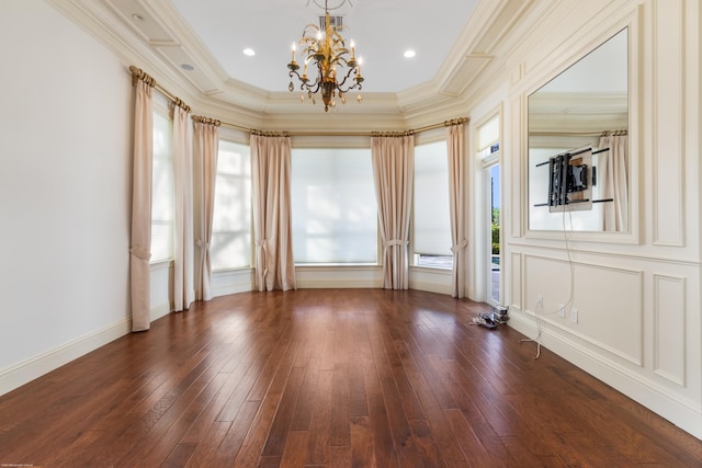 unfurnished room with crown molding, dark wood-type flooring, and a chandelier