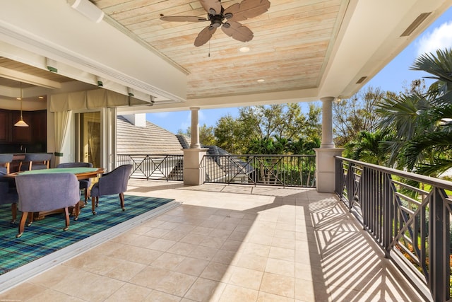 view of patio / terrace with a balcony and ceiling fan