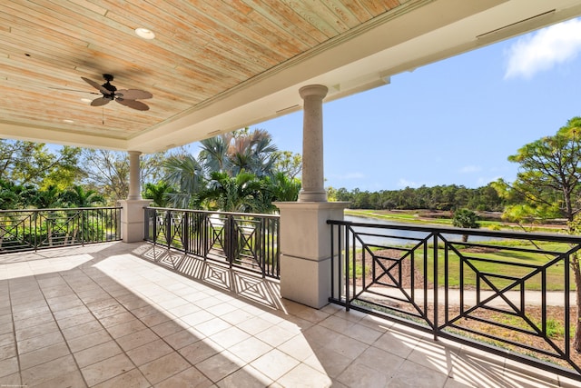 view of patio featuring ceiling fan and a water view