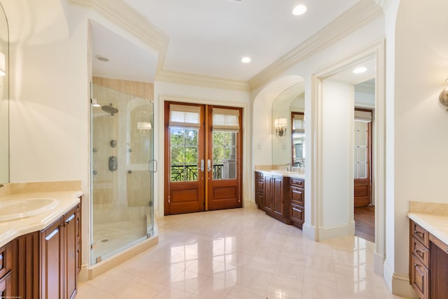 bathroom with crown molding, a shower with door, vanity, and french doors