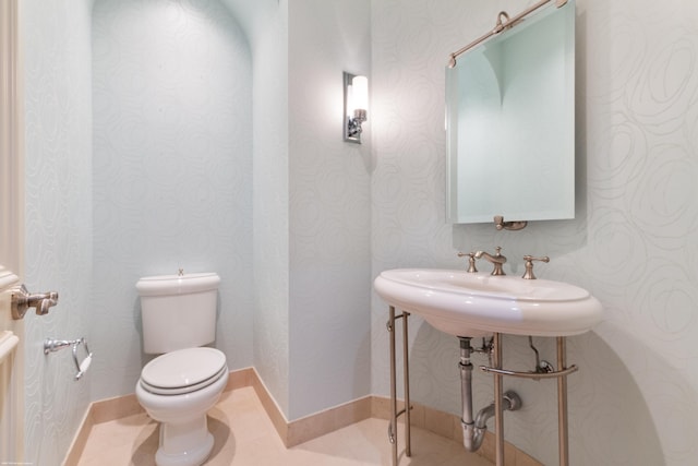 bathroom with toilet and sink