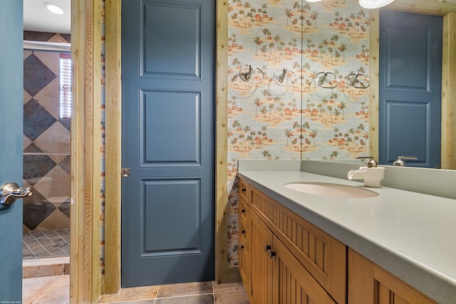 bathroom with tile patterned flooring and vanity