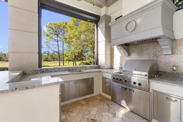 view of patio / terrace featuring a grill, area for grilling, and sink