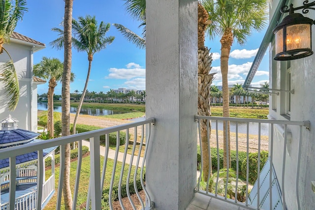 balcony featuring a water view