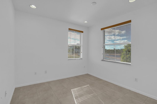 unfurnished room with light tile patterned floors