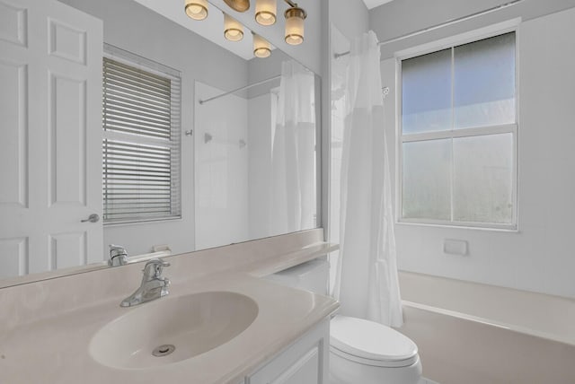 full bathroom featuring vanity, shower / bath combination with curtain, and toilet