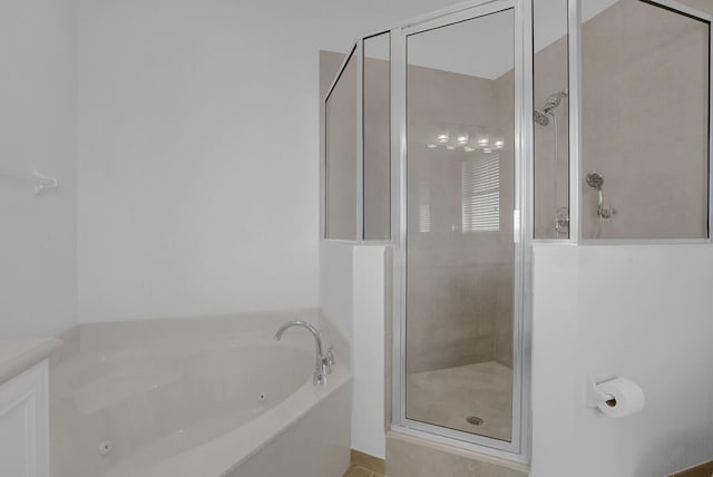 bathroom with separate shower and tub