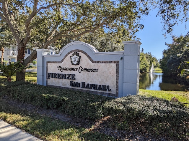 community sign with a water view