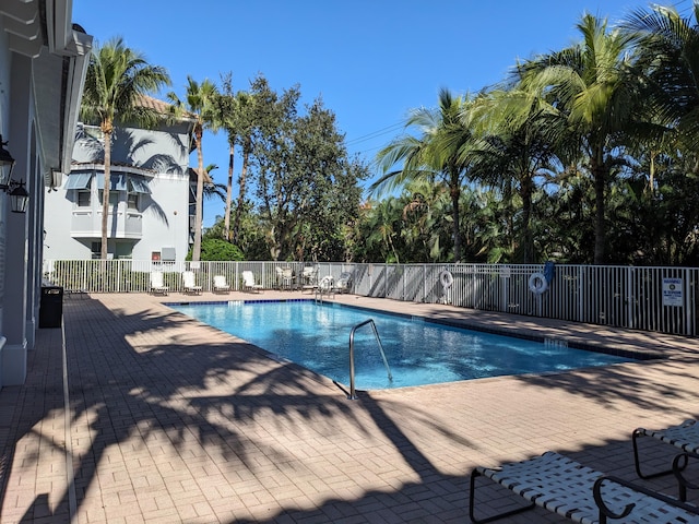 view of swimming pool with a patio