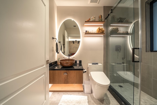 bathroom featuring an enclosed shower, vanity, tile patterned floors, and toilet