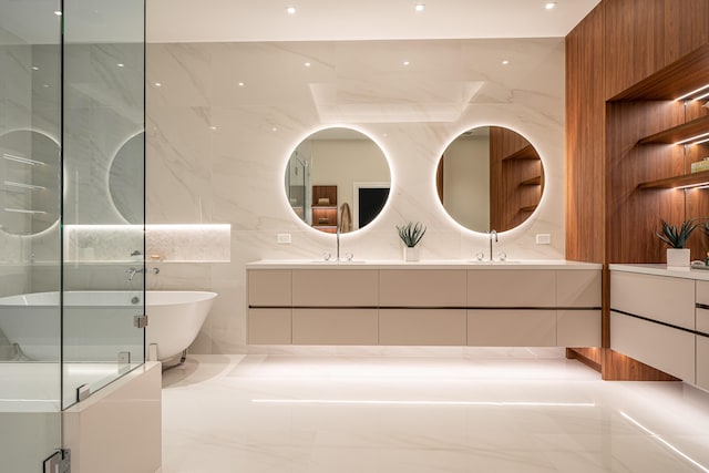 bathroom featuring tasteful backsplash, plus walk in shower, vanity, and tile walls