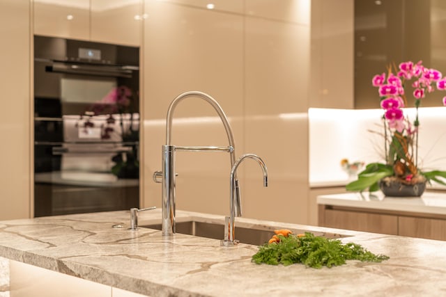 details with white cabinetry and light stone countertops