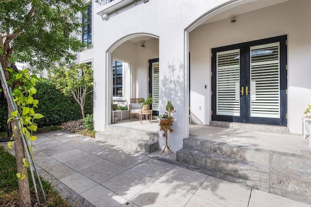 doorway to property featuring a patio and french doors