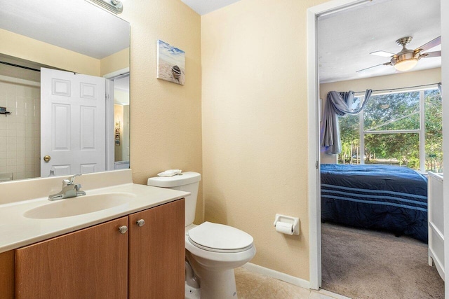 bathroom with ceiling fan, vanity, and toilet