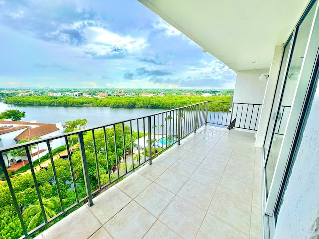 balcony featuring a water view