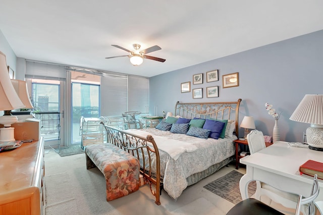 bedroom featuring ceiling fan and access to exterior