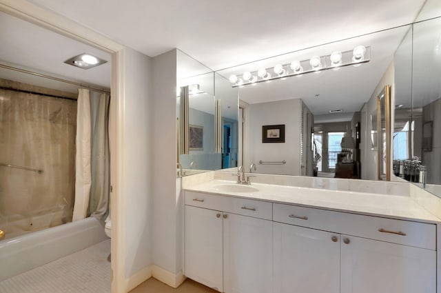 full bathroom with vanity, toilet, and shower / bath combo with shower curtain