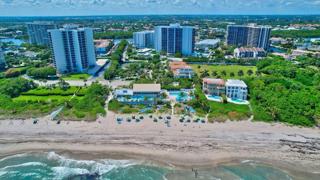 aerial view with a water view and a view of the beach