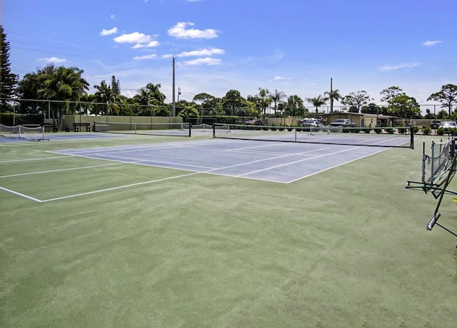 view of tennis court featuring basketball court