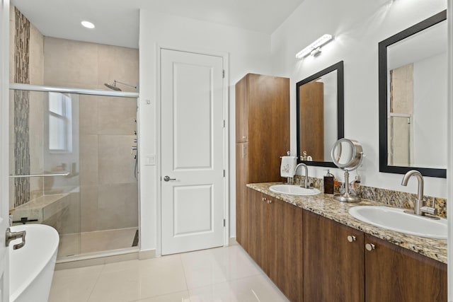 bathroom featuring tile patterned flooring, vanity, and independent shower and bath