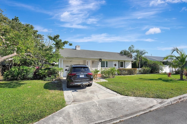 single story home featuring a front yard and a garage