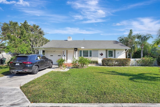 ranch-style house featuring a front yard and a garage