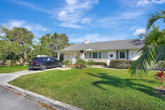 ranch-style house with a garage and a front lawn