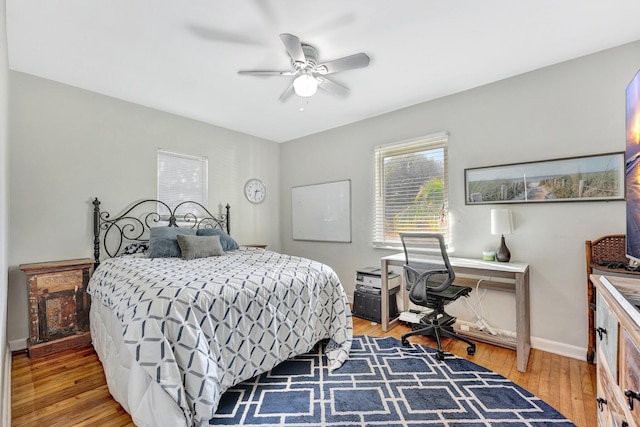 bedroom with ceiling fan and wood-type flooring