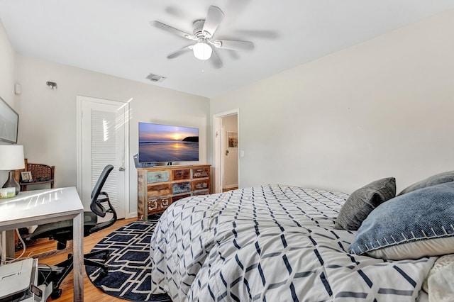 bedroom featuring ceiling fan and hardwood / wood-style floors