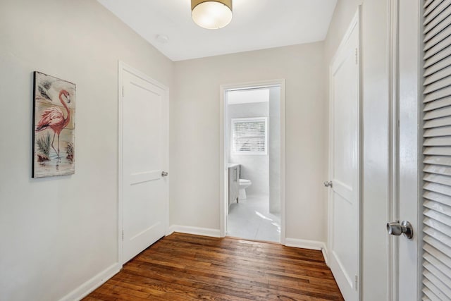 hallway featuring dark hardwood / wood-style floors