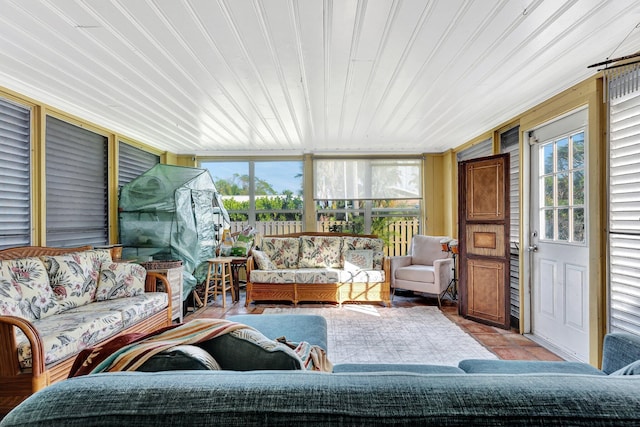 sunroom / solarium featuring a healthy amount of sunlight