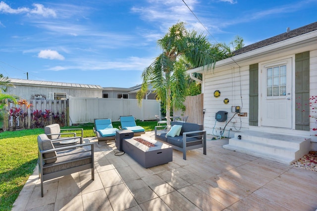 view of patio / terrace featuring an outdoor living space with a fire pit