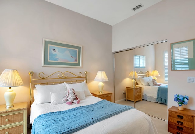 bedroom featuring carpet and a closet