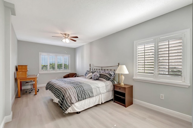 bedroom featuring light wood-type flooring and ceiling fan