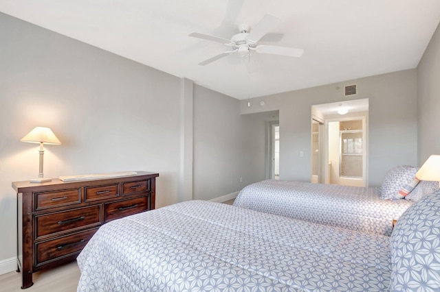 bedroom featuring ensuite bathroom and ceiling fan