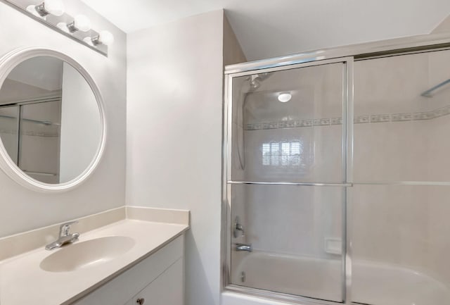 bathroom featuring shower / bath combination with glass door and vanity