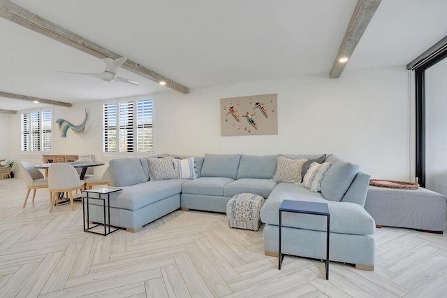 living room featuring ceiling fan, beam ceiling, and light parquet flooring