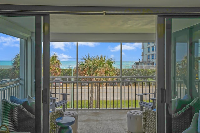 sunroom with a water view