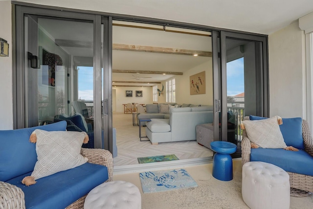 living room with parquet flooring and expansive windows