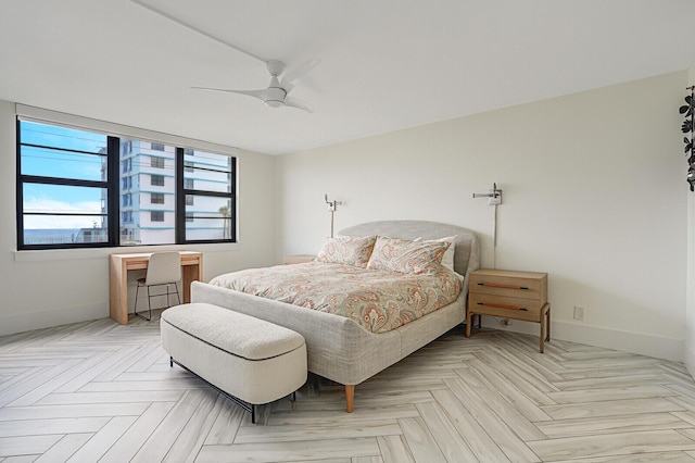 bedroom with light parquet flooring and ceiling fan