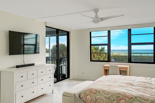 bedroom with light parquet flooring, ceiling fan, and access to outside