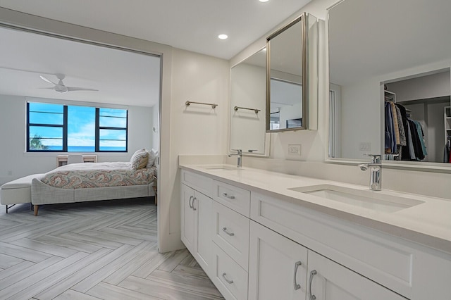 bathroom with vanity, ceiling fan, and parquet floors