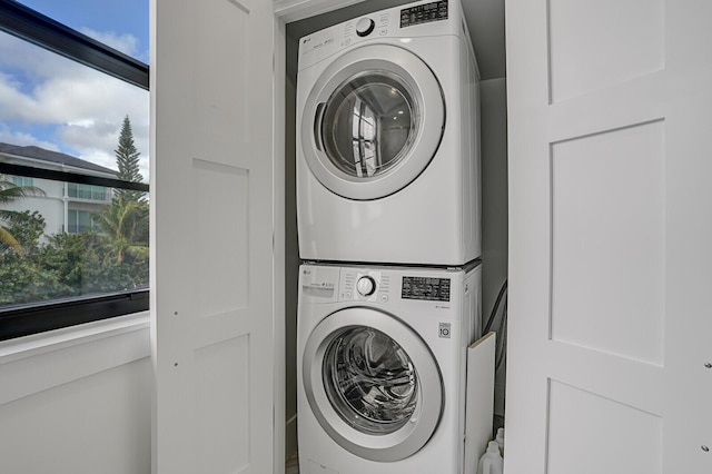 washroom with stacked washer and dryer