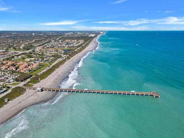 bird's eye view featuring a view of the beach and a water view