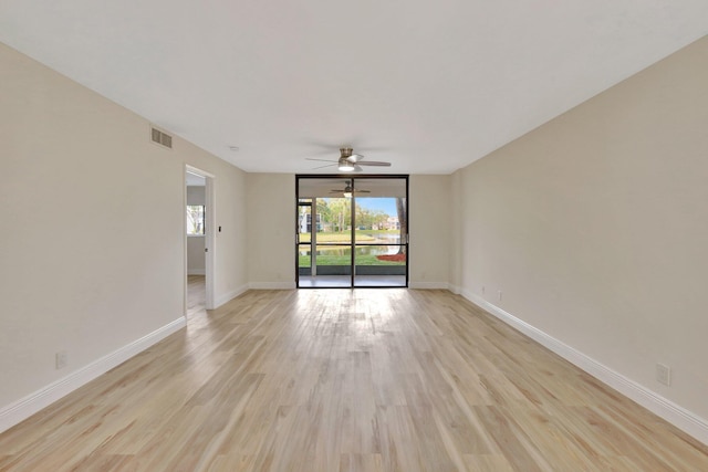 spare room with ceiling fan and light hardwood / wood-style flooring