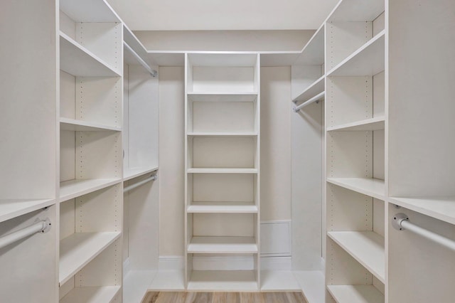 walk in closet featuring light hardwood / wood-style floors