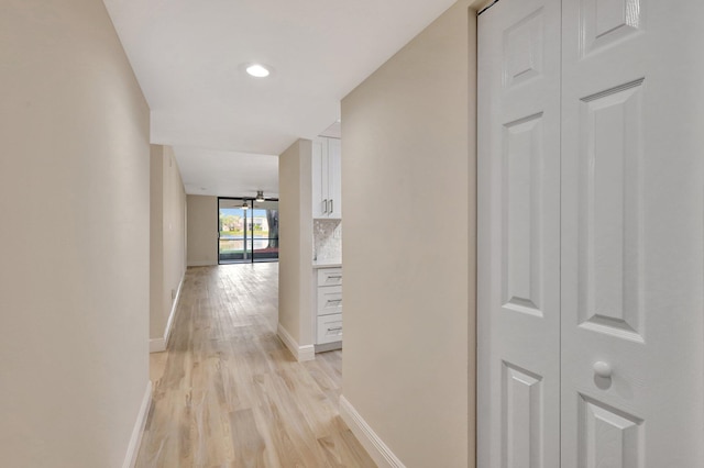 hall with light hardwood / wood-style flooring