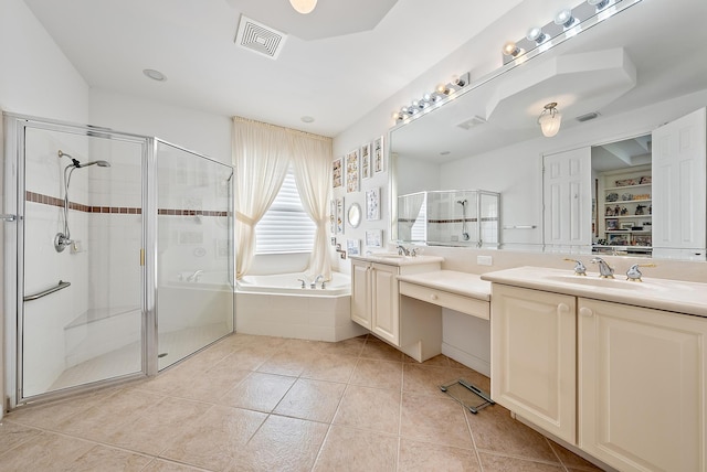 bathroom with tile patterned flooring, vanity, and plus walk in shower